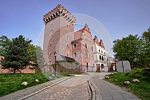 paved road to the reconstructed historic royal castle in Poznan photo