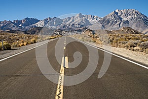 Paved road up to hill Eastern Sierra Nevada mountains