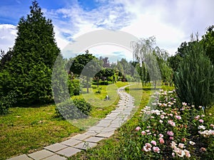 Paved trail at botanical garden in Ploiesti , Romania