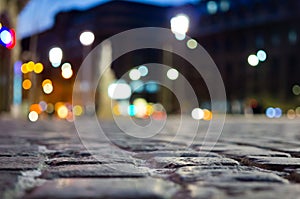 Pavement and blurred city light during night time