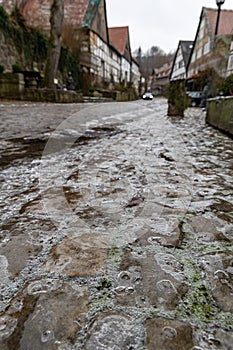 Pavement covered with ice on the street of an ancient European town