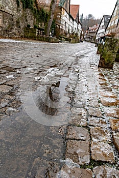 Pavement covered with ice on the street of an ancient European town