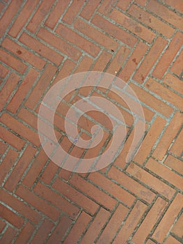 Pavement full frame.Red brick wall background. Full frame of diagonal brick wall. Constructions and Architecture