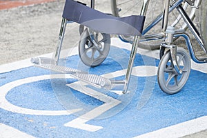 Pavement handicap symbol and wheelchair