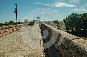 Pavement made of setts on top of Roman bridge int Merida