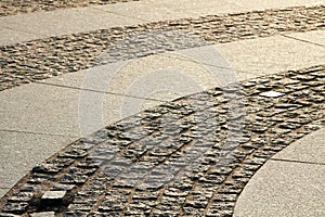 Pavement of the palace square with backlighting of the sunlight