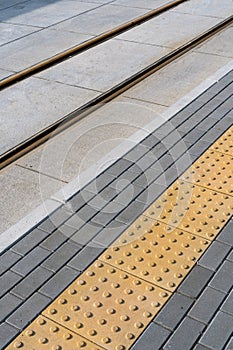 Pavement sidewalk with tactile slab for helping blind people on road