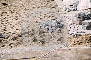 Pavement stones and cobblestone blocks - construction site of path, sidewalk or road