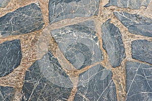 Pavement texture with fragments of natural gray stone