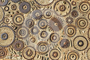 Pavement texture with gears and bricks in Montjuic, Barcelona, Spain.