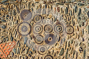 Pavement texture with gears and bricks in Montjuic, Barcelona, Spain