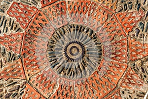 Pavement texture with gears and bricks in Montjuic, Barcelona, Spain. photo