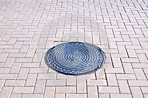 Pavement of tiles with a hatch