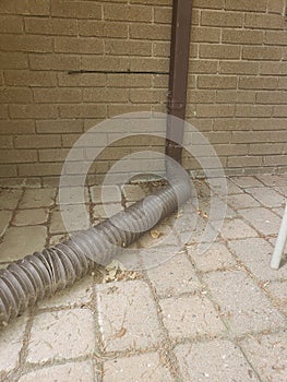 Pavers and roof eve drain hose