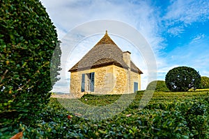 A pavilion and clipped boxwood shrubs at the Marqueyssac Castle in Perigord, France