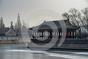 Pavilion by the moat, water became frozen at the Forbidden City in winter, Beijing, China