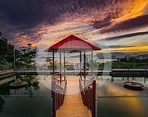 Pavilion on the pond at sunset