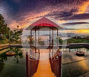 Pavilion on the pond at sunset