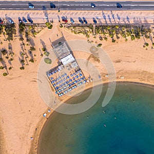 Pavilion on Yellow beach on early morning along road with parking