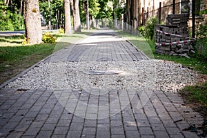 Paving bricks piled by sidewalk, construction work