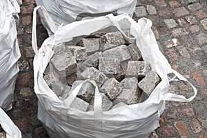 Paving granite cubes in bag