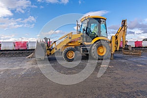 Paving the ground at road construction works with a bulldozer