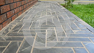 Paving slabs forming a herringbone pattern walkway