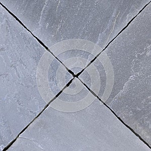 Paving slabs texture in blue-grey color with riven texture