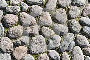 Paving stones background. Sidewalk and city roadway of the old town. Top view