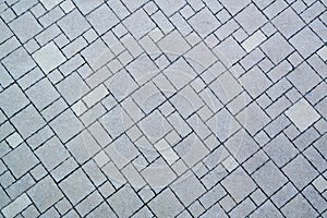 Paving tile of gray color by diagonal
