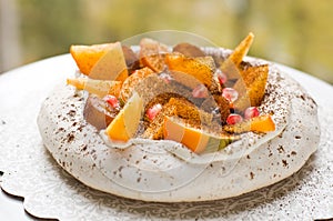 Pavlova cake with exotic fruits photo