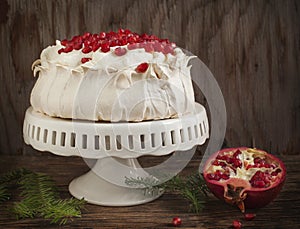 Pavlova cake with pomegranate photo