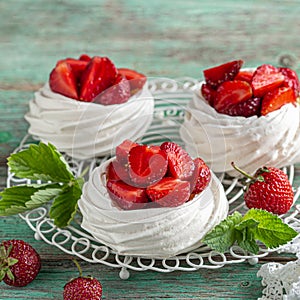 Pavlova cakes with fresh strawberry photo