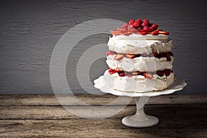 Pavlova, a Layered Meringue Cake with Fruit and Whipped Cream