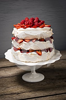 Pavlova, a Layered Meringue Cake with Fruit and Whipped Cream