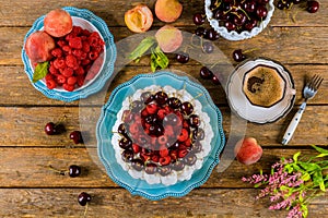 Pavlova meringue cake with a cup of coffe, top view