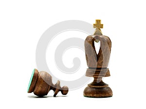 Pawn Lying In Front of A King Chess Piece, Isolated On White