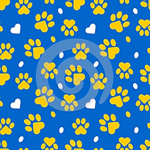 Paws of a cat, dog, puppy. Seamless cute pattern of animal footprints for textile. Blue and yellow colors.