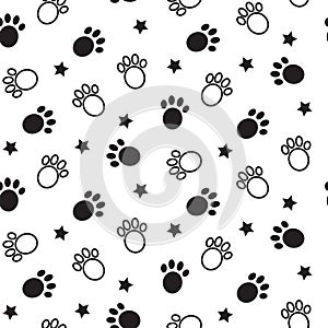 Paws seamless vector pattern. Animal tracks black and white background.