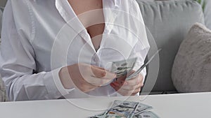 pay day money loan woman counting 100 dollars cash