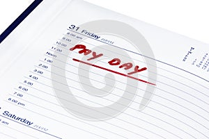 Pay day written in red in a diary