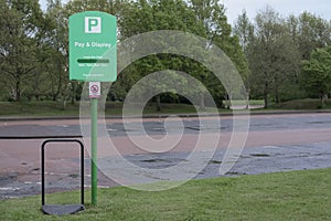 Pay and display carpark sign pay ticket fine vehicle safe park spaces empty car park