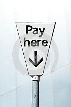 Pay Here sign. Pay and display carpark