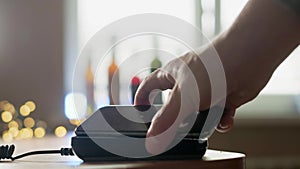 Pay by phone on the POS contactless payment terminal. A user makes a purchase using a smartphone in a store or