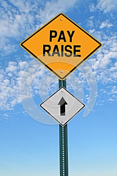 Pay raise ahead roadsign photo