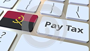 PAY TAX text and flag of Angola on the buttons on the computer keyboard. Taxation related conceptual 3D rendering