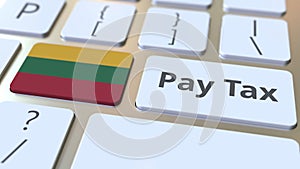 PAY TAX text and flag of Lithuania on the buttons on the computer keyboard. Taxation related conceptual 3D animation