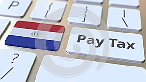 PAY TAX text and flag of Paraguay on the buttons on the computer keyboard. Taxation related conceptual 3D animation