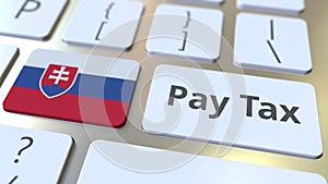 Pay tax text and flag of Slovakia on the buttons on the computer keyboard. Taxation related conceptual 3D animation