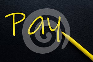 Pay Yellow Pen with yellow text own rent at the black background